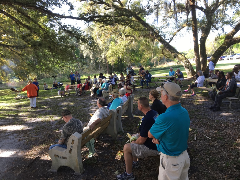 Carib Traditional Queen (in orange jacket) opens ceremony for Annual Seminole Maroon Commemorative in Loxahatchee River Battlefield Park.